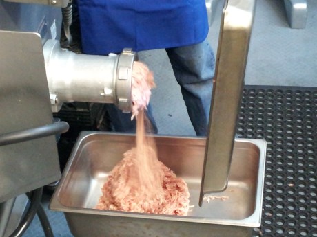 Chicken thighs sent through a huge grinder. It took less than 20 seconds to grind 12 lbs of chiciken!