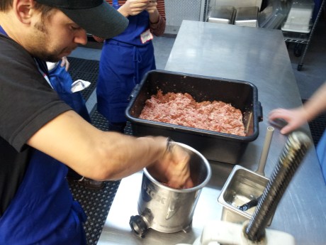 Filling the bin with product. No air is permitted because it causes bubbles in the casing. 