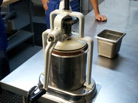 This is a table mounted crank stuffer. Recommended because electric stuffers do not allow to slow down or back up if gravity takes hold and pushes too much product out at once. 