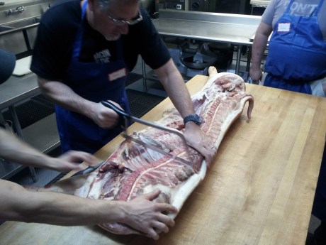 Hack sawing the carcass into sections